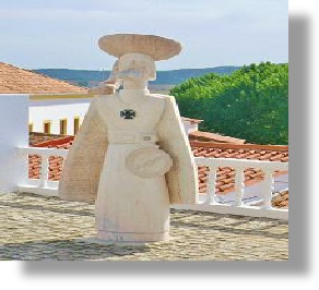 marble statue overlooking the new town of Aljezur